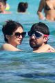 gemma chan dominic cooper kiss on vacation in spain 01