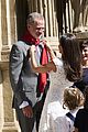 king felipe gets help from queen letizia red scarf pamplona event 05