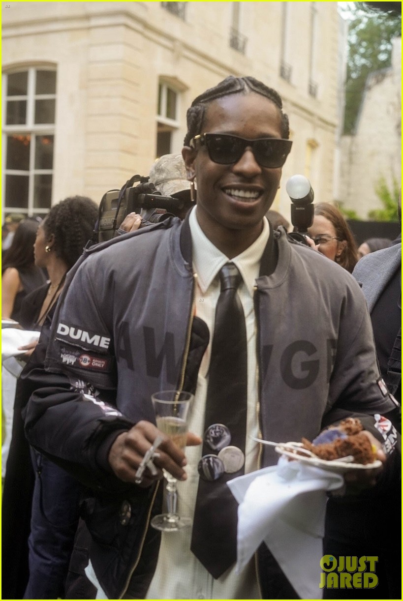 Rihanna Supports AAP Rocky at His Paris Fashion Week Show, Debuts New