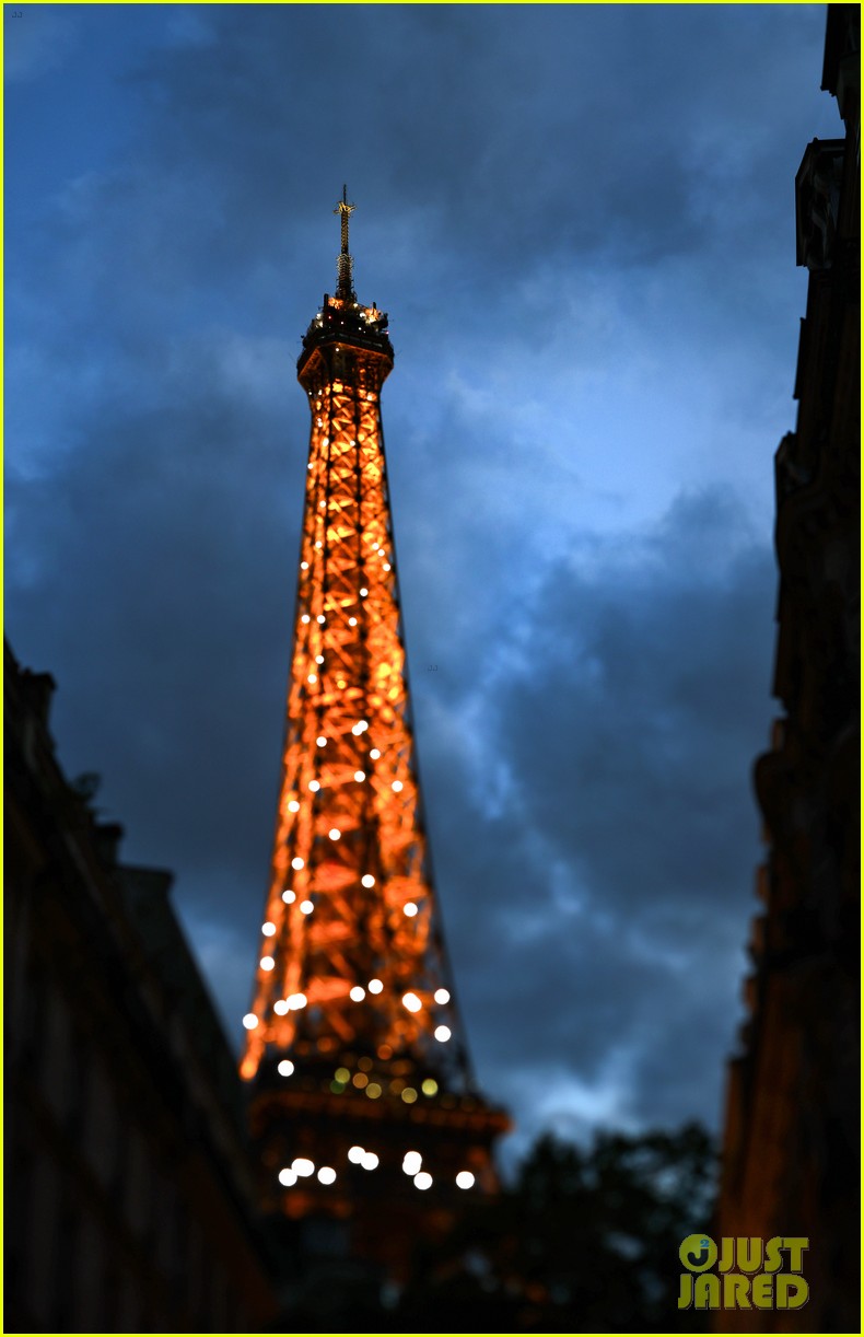 The Moon Lines Up Perfectly with Eiffel Tower's Olympic Rings, Photos