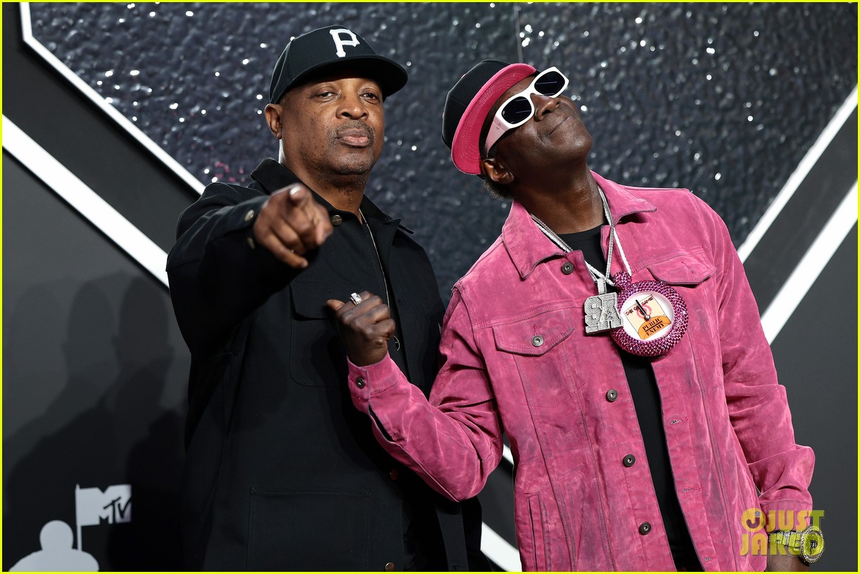 Flavor Flav Gives Jordan Chiles Her Bronze Clock on VMAs Stage