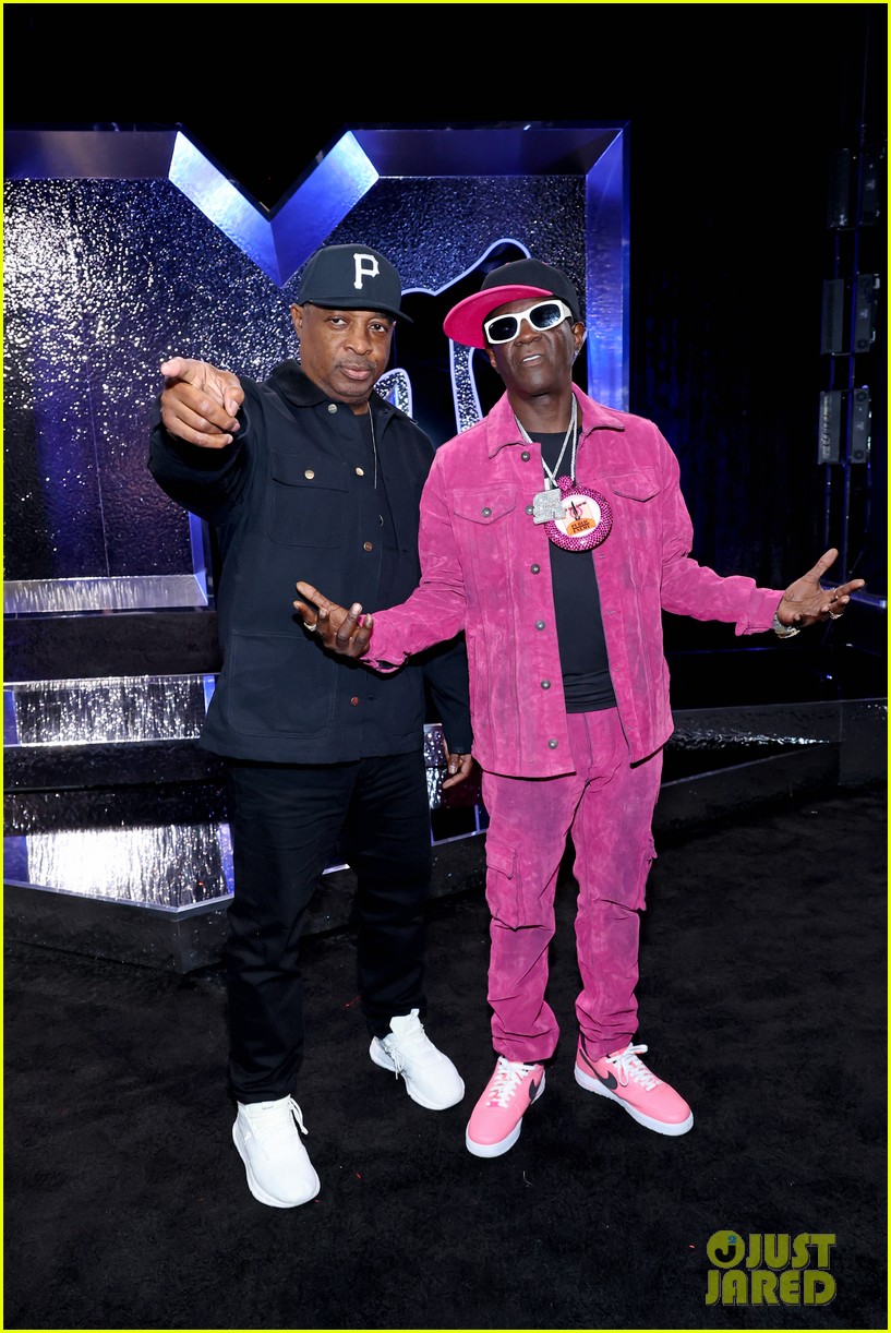 Flavor Flav Gives Jordan Chiles Her Bronze Clock on VMAs Stage