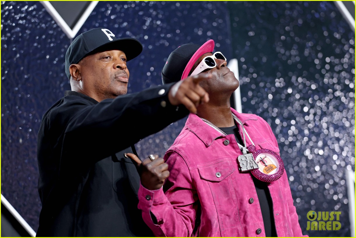 Flavor Flav Gives Jordan Chiles Her Bronze Clock on VMAs Stage