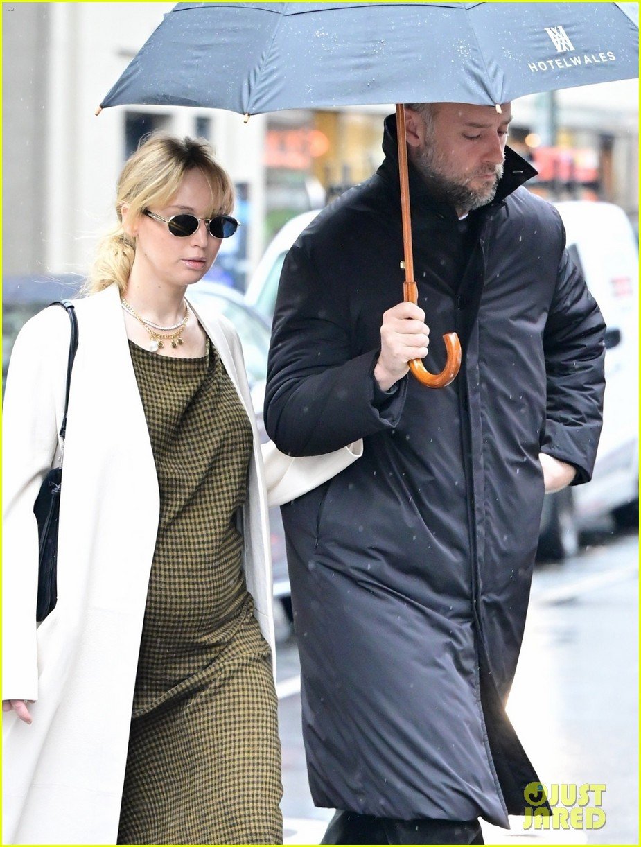 Pregnant Jennifer Lawrence & Husband Cooke Maroney Brave Rainy Weather