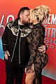 jelly roll bunnie xo show some pda on red carpet at acm awards 2025 03