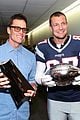 tom brady rob gronkowski break lombardi trophy at fanatics fest nyc 01