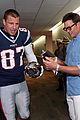 tom brady rob gronkowski break lombardi trophy at fanatics fest nyc 05