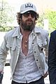 aaron taylor johnson sports bushy beard as he arrives in venice 04