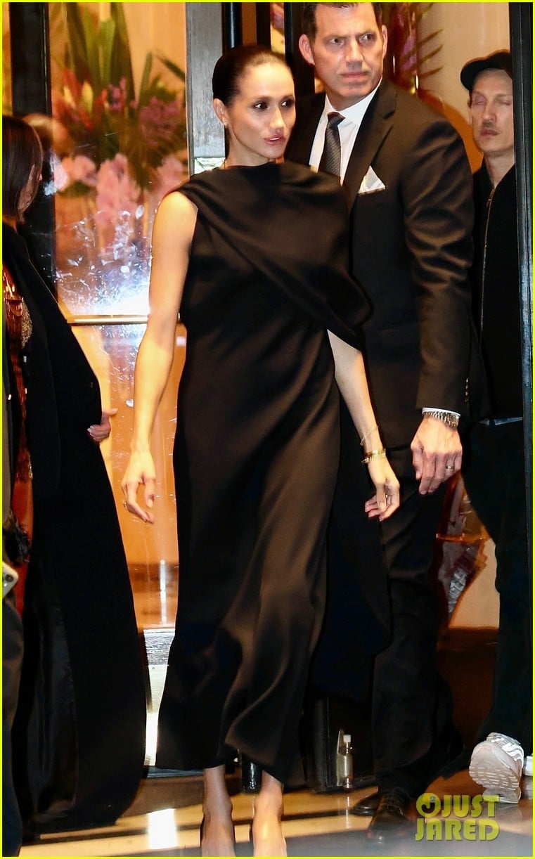 Meghan Markle Wears Elegant Black Dress With a Cape During Paris