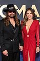 billy ray cyrus elizabeth hurley hold hands at cma awards 2025 05