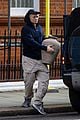 taron egerton picks up art from a gallery in london 03