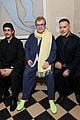 elton john david furnish make rare public appearance at jacquemus fashion show 03