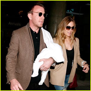 Guy Ritchie Carries His Son Through LAX