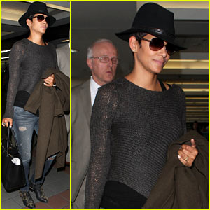 Halle Berry Covers Baby Bump at LAX