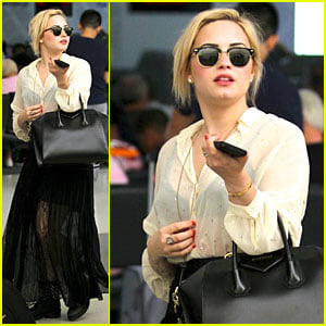 Demi Lovato: Sheer LAX Arrival After Father's Death