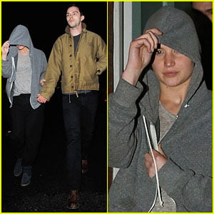 Jennifer Lawrence Hides Under a Hoodie & Uses Boyfriend Nicholas Hoult as Her Guide!