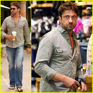 Gerard Butler Scopes Out Surf Gear After Kissing Session with Mystery Girl