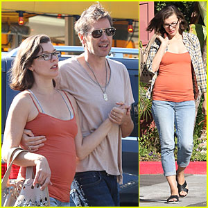 Milla Jovovich Is An Orange Slice of Pregnant Heaven During Lunch Date With Husband Paul W.S. Anderson