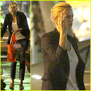 Charlize Theron Flips Off Paparazzi During Rainy Grocery Run