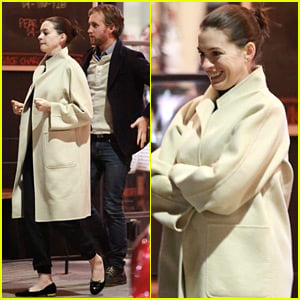 Anne Hathaway Keeps Her Baby Bump Covered Up