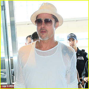Brad Pitt Wears Sheer Top for Flight Out of Town