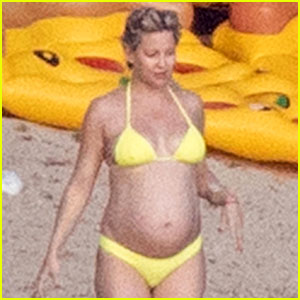 Pregnant Kate Hudson Hits the Beach in Bright Yellow Bikini