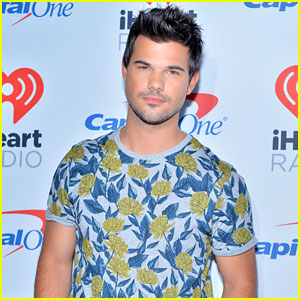 Taylor Lautner Flexes His Massive Arm Muscles in a Tank Top