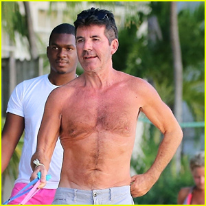 Simon Cowell Goes Shirtless for Dog Walk on Barbados Beach