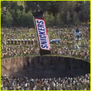 Snickers' Super Bowl 2020 Commercial Aims To Fix The World By Feeding The World a Giant Bar