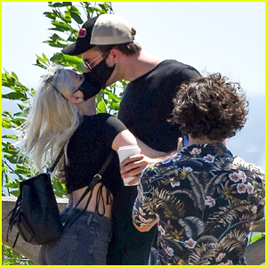 Ariel Winter & Boyfriend Luke Benward Kiss Through Their Masks