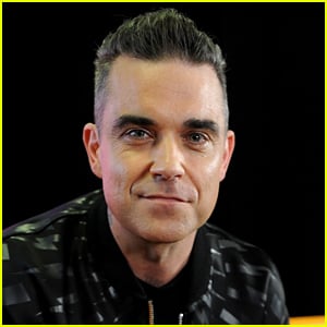 Singer Robbie Williams Says He Almost Died From Eating Too Much Fish