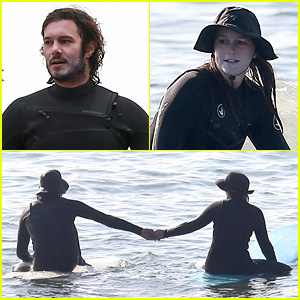 Leighton Meester & Adam Brody Adorably Hold Hands While Riding Their Surfboards in the Ocean