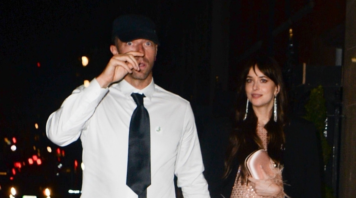 Dakota Johnson & Chris Martin Hold Hands in Rare Photos Together