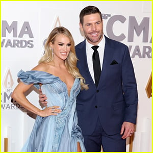 Carrie Underwood is joined by husband Mike Fisher on the red carpet at the  CMA Awards, where she will be participating in three separate