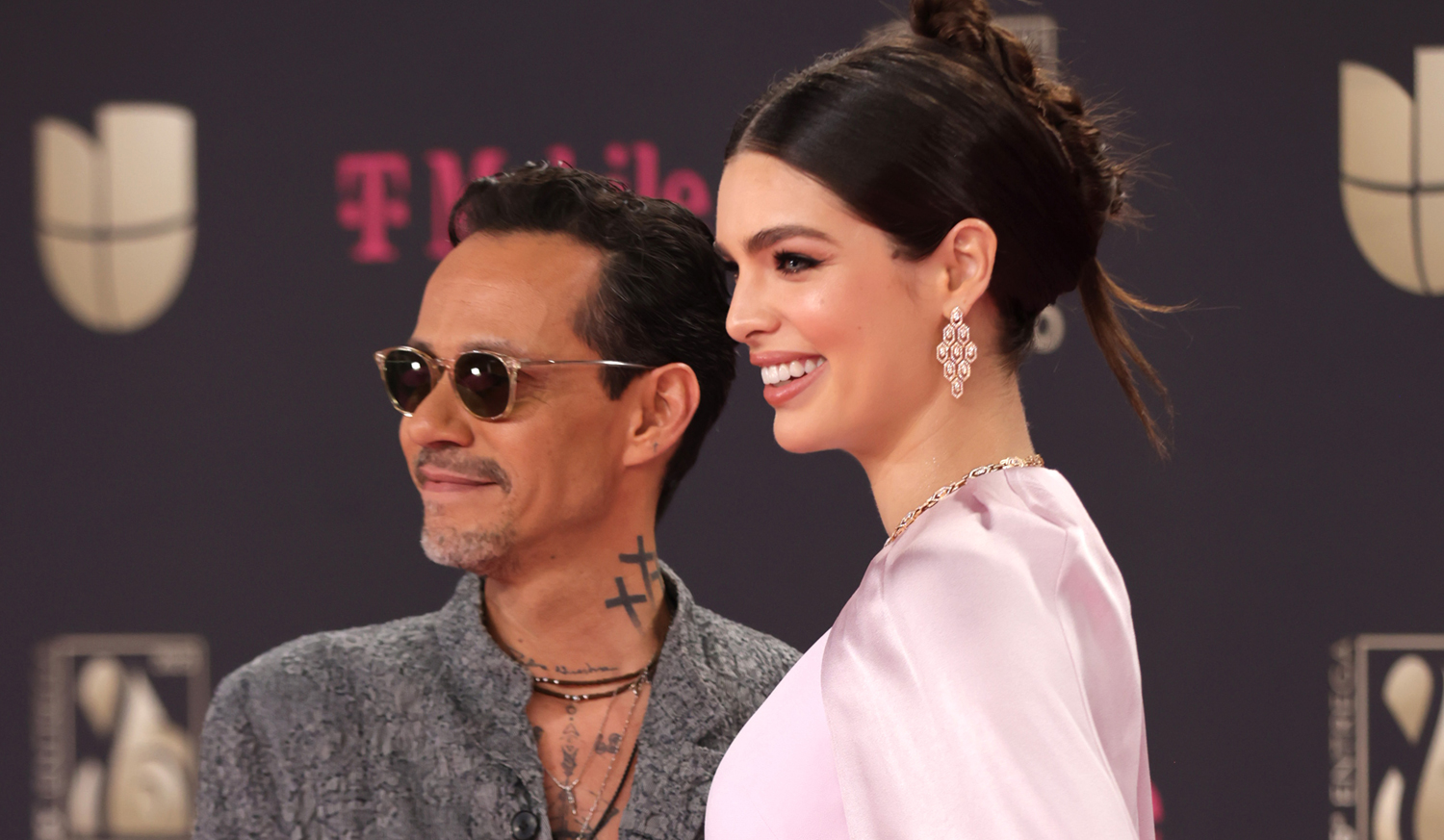 Marc Anthony Cradles Wife Nadia’s Baby Bump While Walking Red Carpet at
