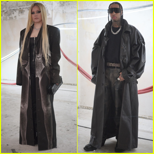 Avril Lavigne & Tyga Coordinate in Long Black Jackets at Y/Project Show as Dating Rumors Heat Up