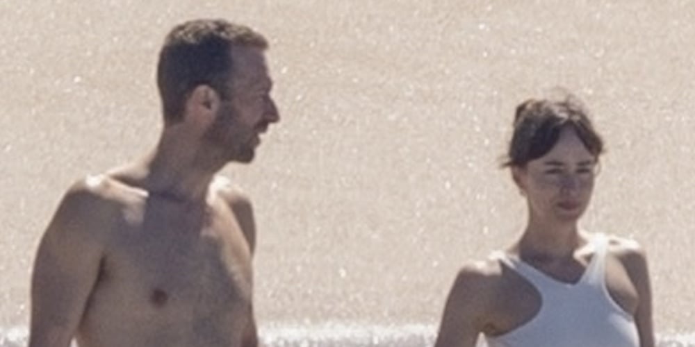 Dakota Johnson & Chris Martin Hold Hands on Beach After Her ‘Madame Web’ Press Tour
