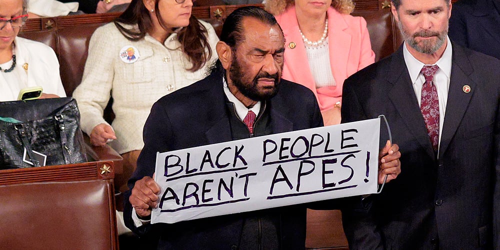 Al Green Removed from Chamber During Donald Trump’s Statue of the Union While Holding Sign Saying ‘Black People Aren’t Apes’